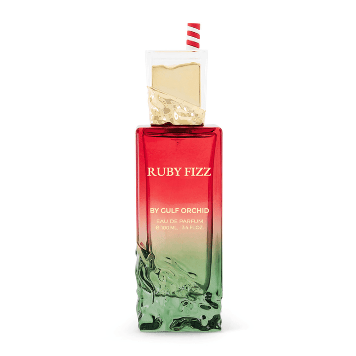 Perfume femenino Ruby Fizz by Gulf Orchid, eau de parfum exclusivo en frasco degradado rojo y verde con detalle decorativo elegante.
