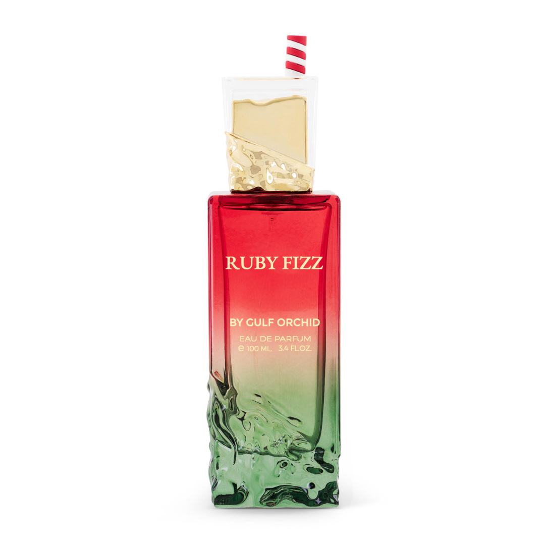 Perfume femenino Ruby Fizz by Gulf Orchid, eau de parfum exclusivo en frasco degradado rojo y verde con detalle decorativo elegante.